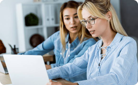 img - group-young-entrepreneurs-working-laptops-chatting-together-office-1